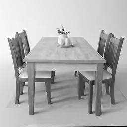 black and white photograph of table and chairs