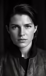 a woman that is looking at the camera
