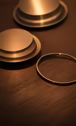 an image of two shiny metal objects on top of the table