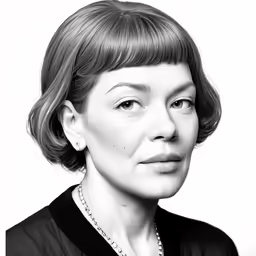 a woman is posing in front of a white background