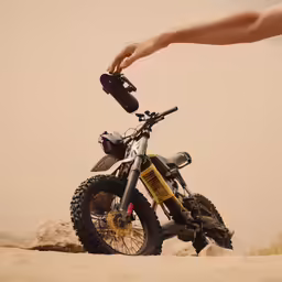 a dirt bike that is parked on some rocks