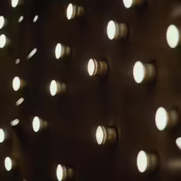 the lights are shining brightly on a wall