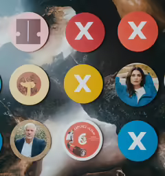 a collage of different colored buttons attached to a wall