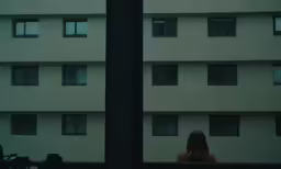a view from outside the window of a building across a street