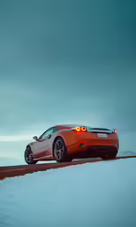 a red car with its lights on standing in a field