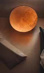 the light in this photo shows a very old round lamp