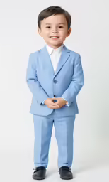 a young boy is dressed in a light blue suit