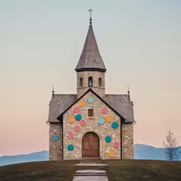 a church with a unique architectural design and some stairs leading up to it