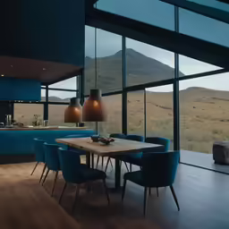 a dinning room with blue chairs around a wooden table