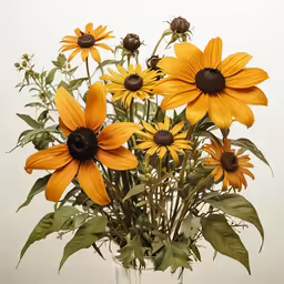 a vase filled with yellow flowers on top of a table