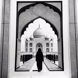 the woman stands in front of a building