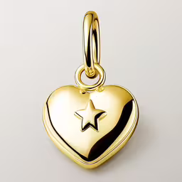 gold heart shaped locke charm with star on it,a heart shaped locke charm with a star