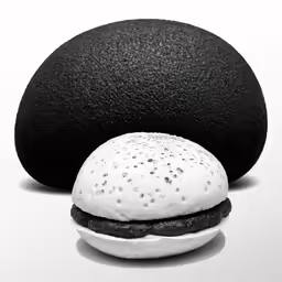 an egg sitting on top of a black burger