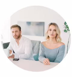a man and woman, with a white circular frame