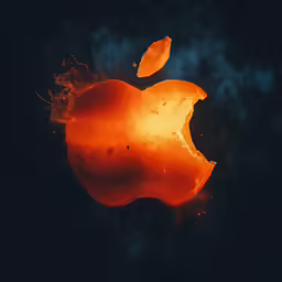 an apple is glowing orange and glowing red