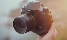 a person holding a camera taking a picture