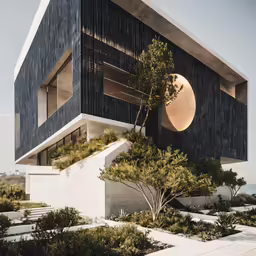 there is a large building with trees and bushes on it