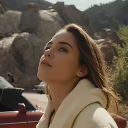 the woman is staring off into the distance