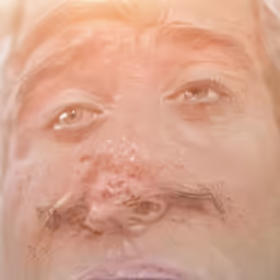 an open eyes man with a mustache looks up