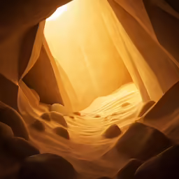 light falls into an empty room in a cave
