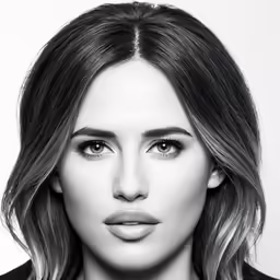 a beautiful woman posing for a black and white photo