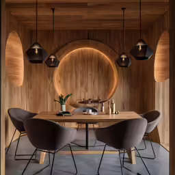 modern dining area with circular lights and table