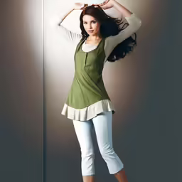 young woman in an green top standing by a lamp