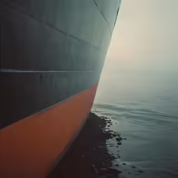 a ship with the ocean in the background