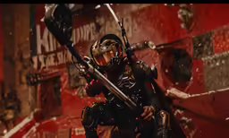 a person with two guns and one wearing a suit