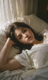 a woman is sleeping in the sun while holding her pillow