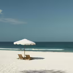 a beach that is empty and has an umbrella over the beach