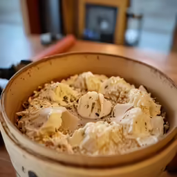 a bowl with a cake in it on a table