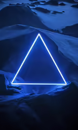 a triangular shape has a blue glow in the middle