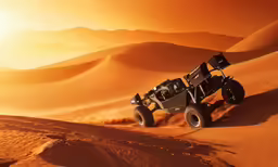 a black four wheel drive vehicle driving on sand