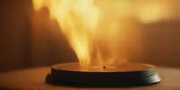 a candle sitting on top of a wooden table