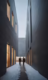 three people walk through an icy corridor between buildings