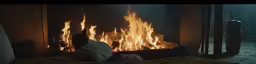 a man sitting in front of a fire