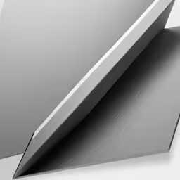 a silver colored wall that has a curved design