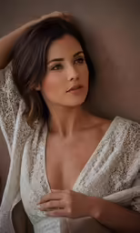a beautiful woman with brown hair posing for the camera