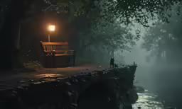 a bench sits beside the river at night