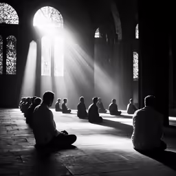 a person sitting in the sun on the floor