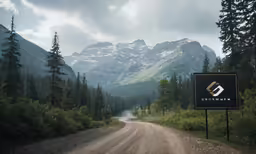 a gravel road with an ad on the side of it