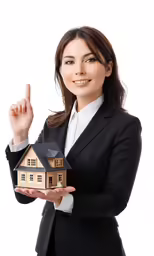 a business woman holding a house and giving the vulcan signal