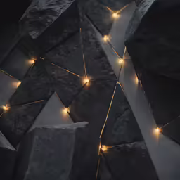 lights shine in between the rocks on top of them