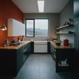 a kitchen with a red accent wall and wooden counter tops