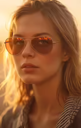 a woman in sun glasses with blonde hair