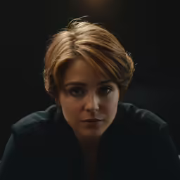 a close up of a person staring to their left