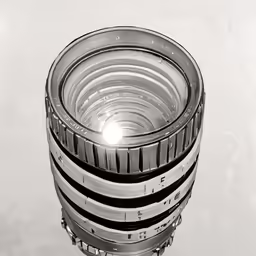 a camera lens with multiple sections and four sections to one section