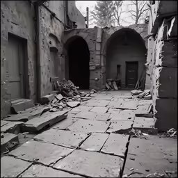an abandoned courtyard with benches and broken windows