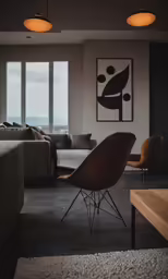 a living room filled with furniture and windows